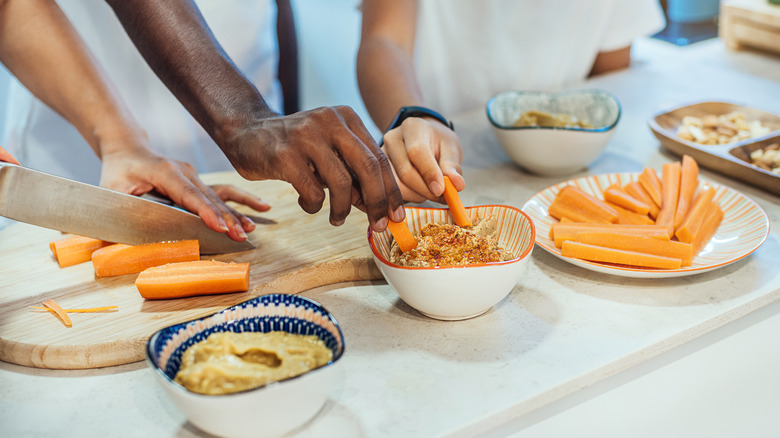 Family eating snacks with dip