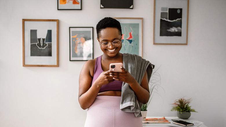 Young woman looking at her phone