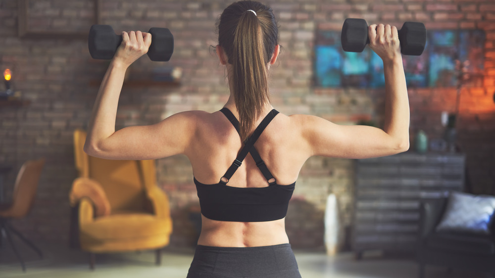 woman lifting weights