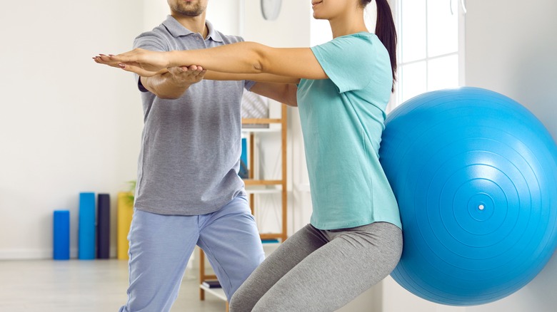 Woman doing stability ball squats