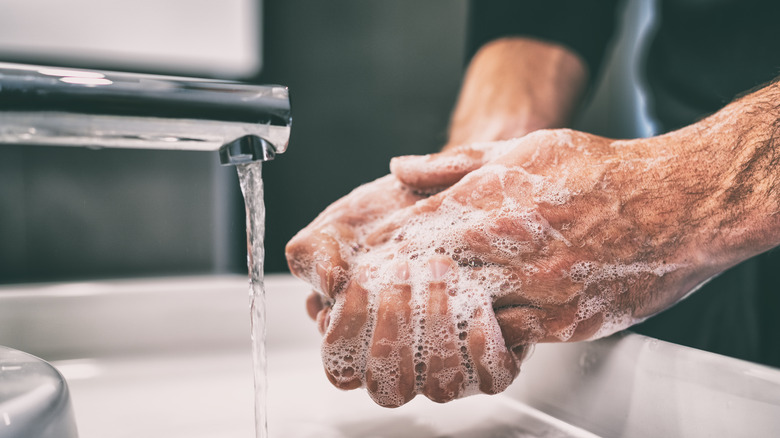 man washing hands