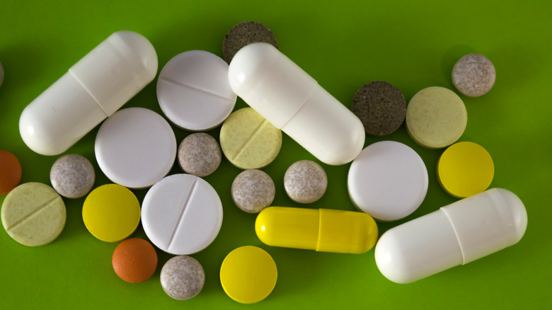 pills and capsules on table