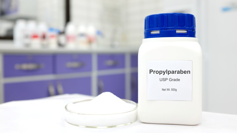 White powder in petri dish nexto to Propylparaben container
