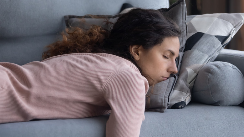 woman sleeping on sofa