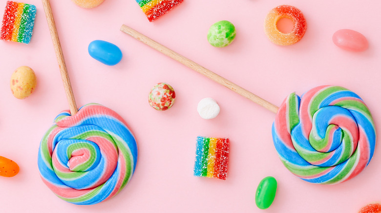 assorted candies on pink background