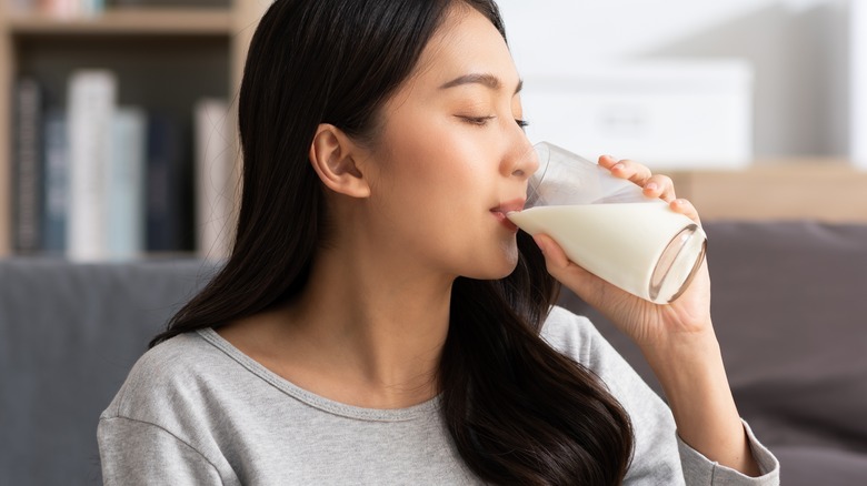 woman drinking glass of milk