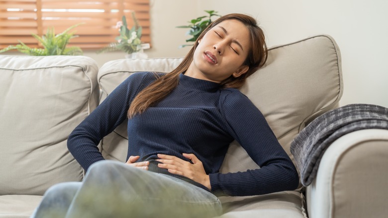Woman with fatigue and abdominal cramps