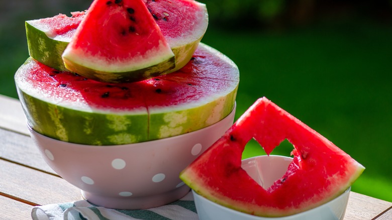 Slices of watermelon on wooden table