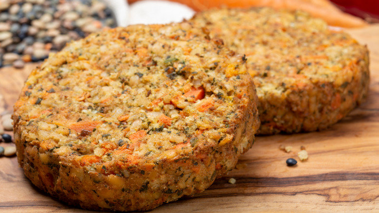 vegetarian burger on wooden chopping board