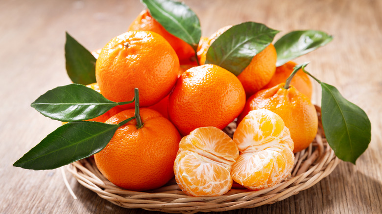 tangerines arranged in small basket