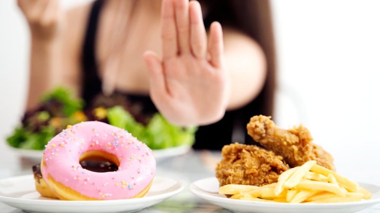 woman rejecting fried foods