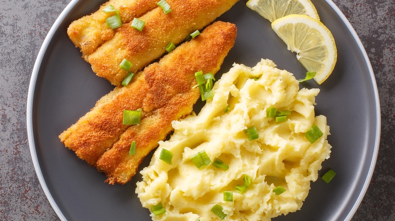mashed potato on plate with fish