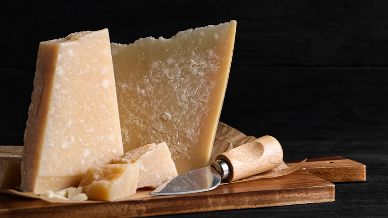 Parmesan cheese with board and knife