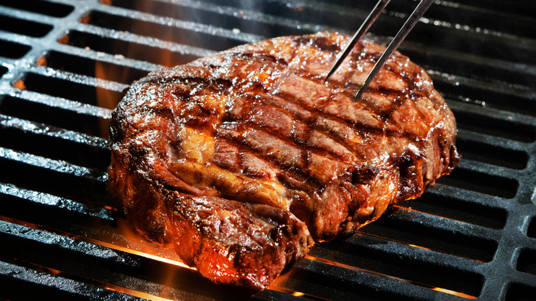 Steak being cooked on a grill
