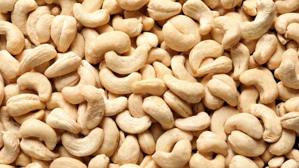 A pile of cashews piled on top of each other