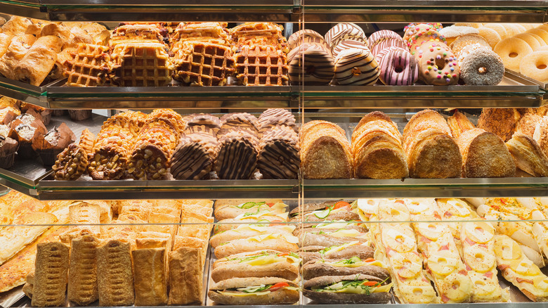 A stocked and well-lit pastry case filled with treats