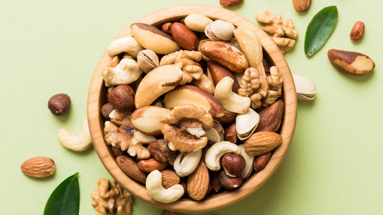 variety of nuts in a wooden bowl