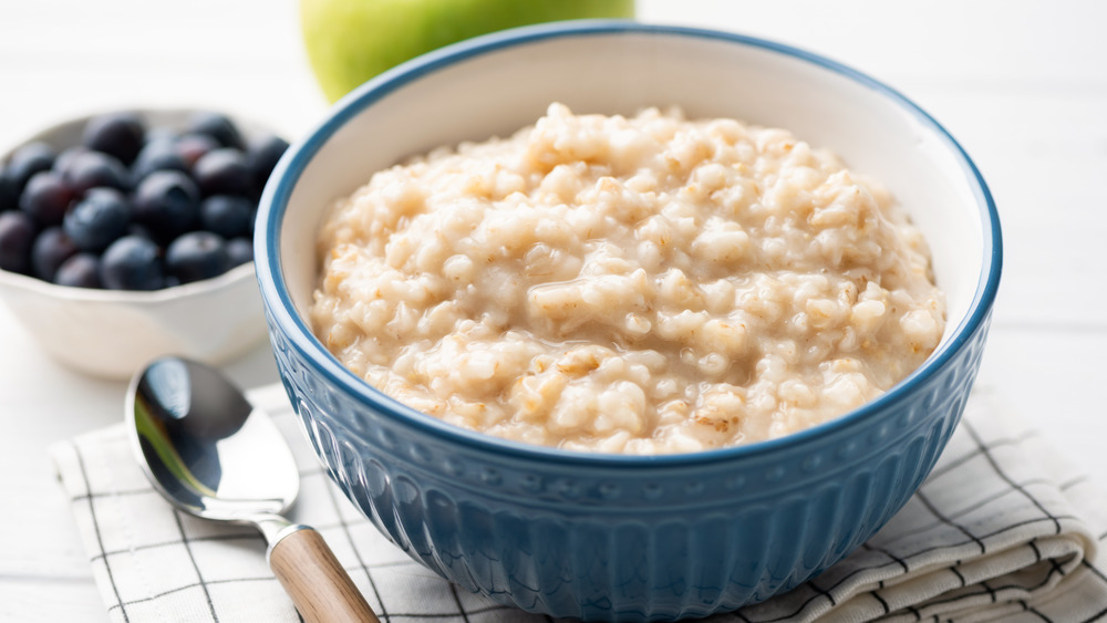 Bowl of creamy oatmeal on the table