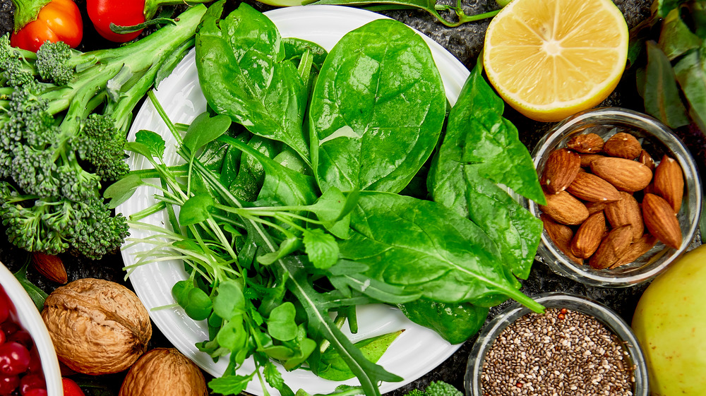 Spinach on a plate surrounded by other vegetables