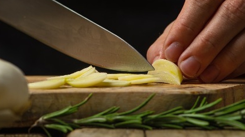 Chopping a garlic clove