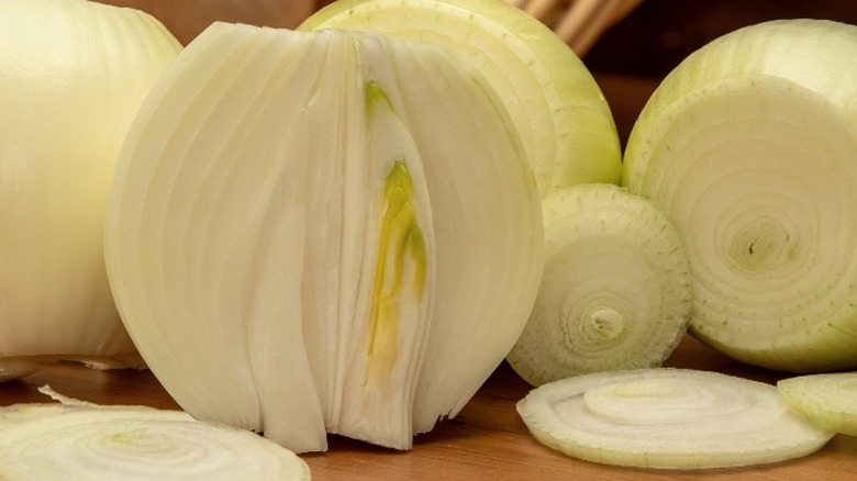 Cut white onions on table