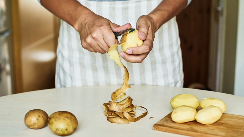 peeling potatoes