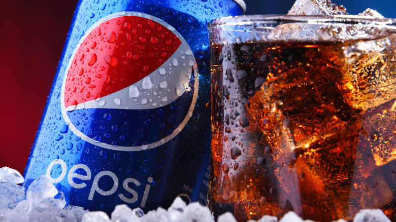 pepsi in glass and can