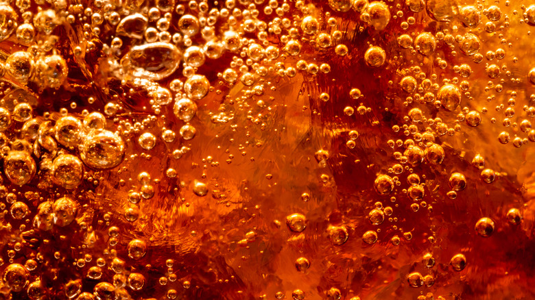 close up of coca cola bubbles