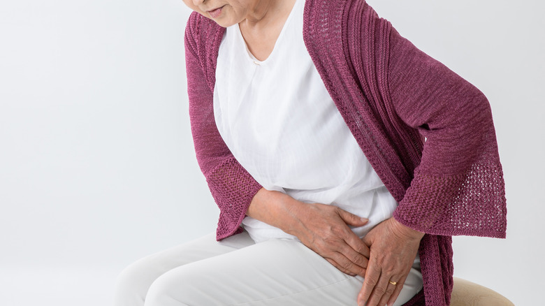 A woman has hip pain from cancer