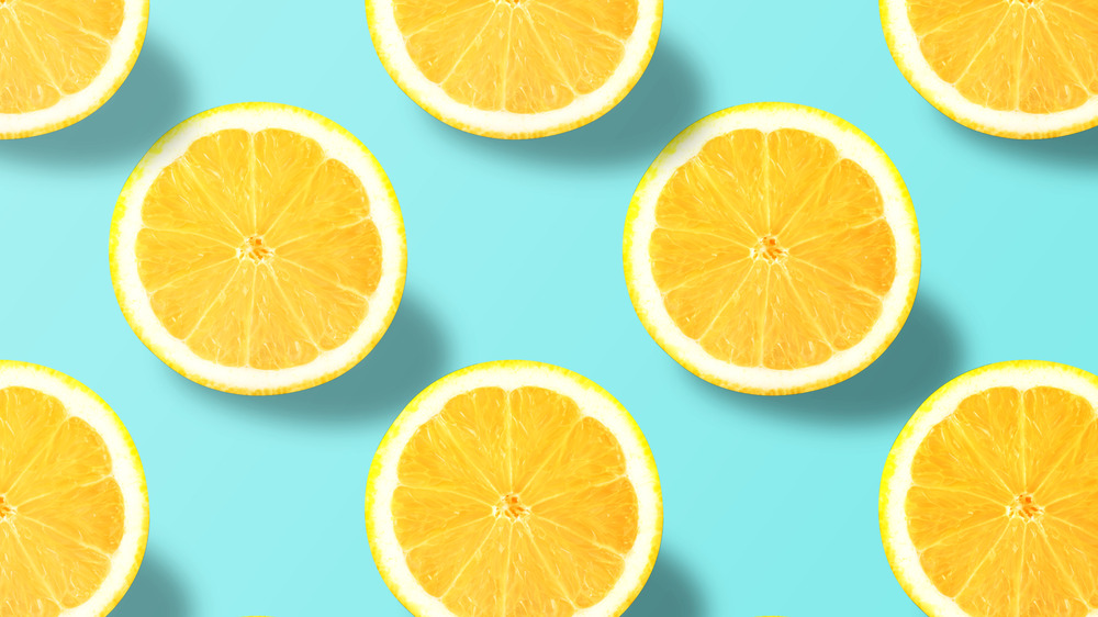 Sliced lemons on a blue background