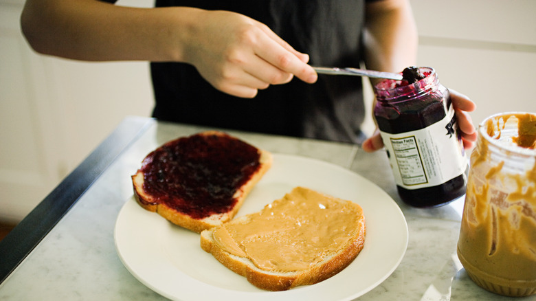 Man making peanut butter sandwich