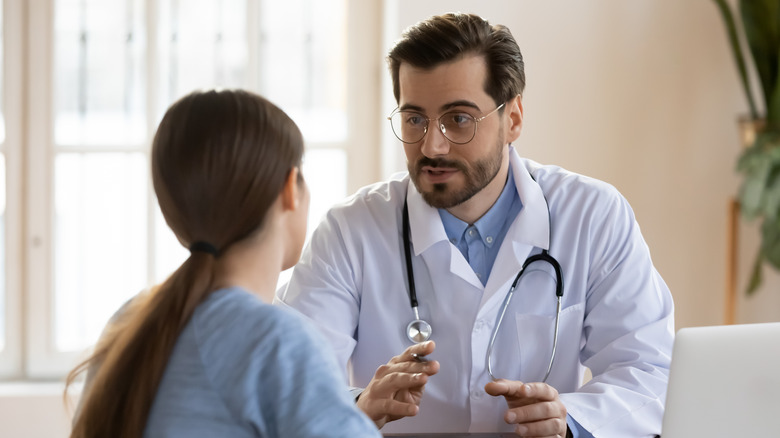 woman talking to doctor