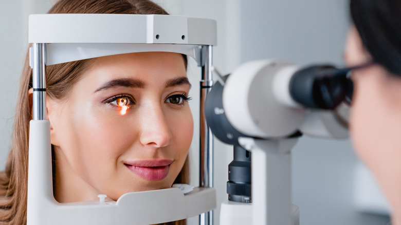 Woman undergoing regular eye exam