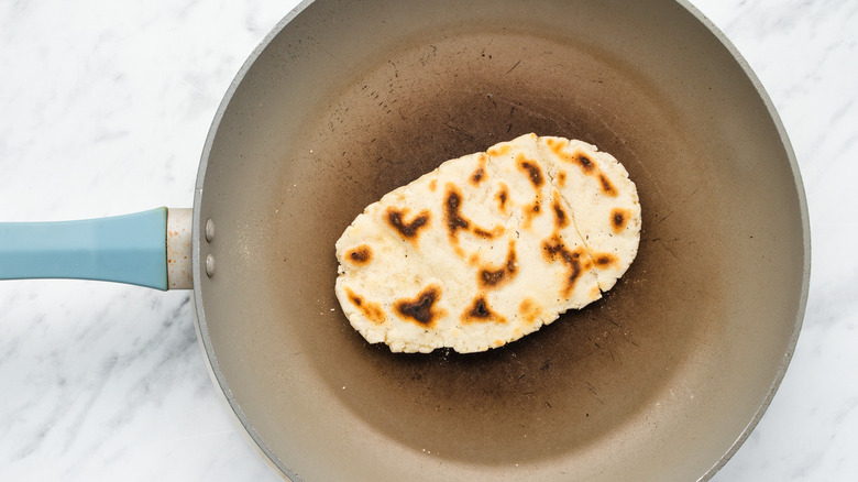 naan cooking in pan 