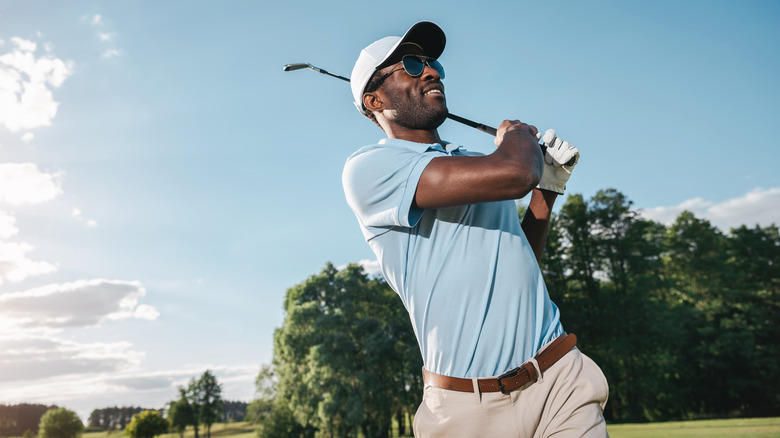 African American man playing golf