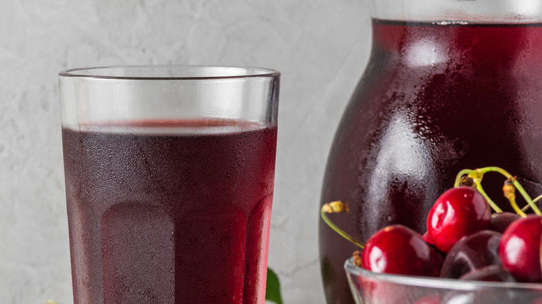 cherry juice in glass and pitcher