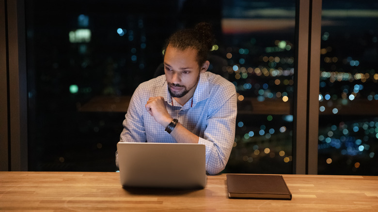 man working at office late