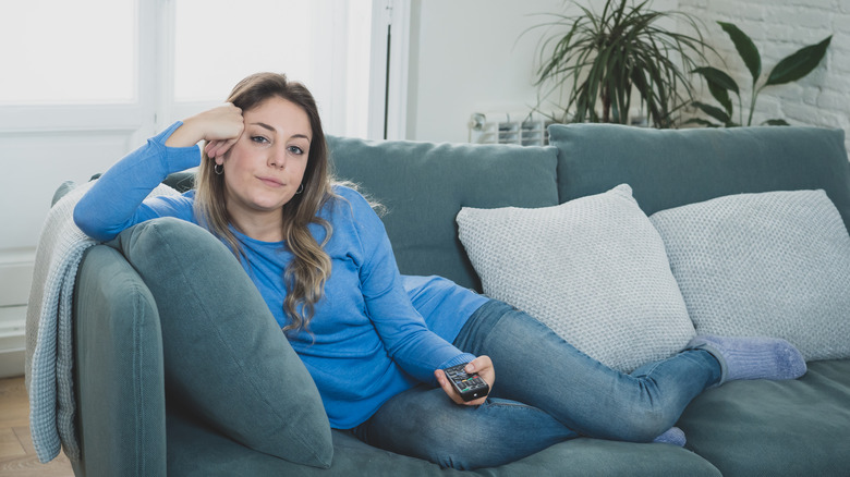 girl bored watching tv