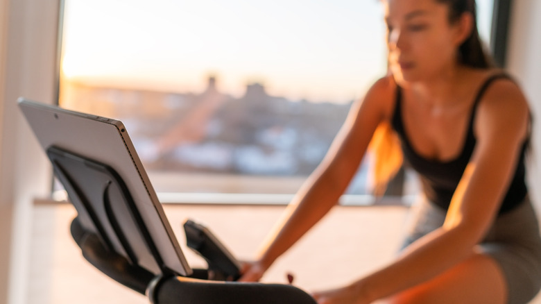 woman working out on exercise bike