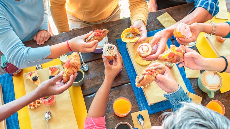 group of friends eating breakfast