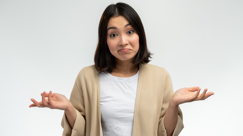 woman with palms up looking perplexed