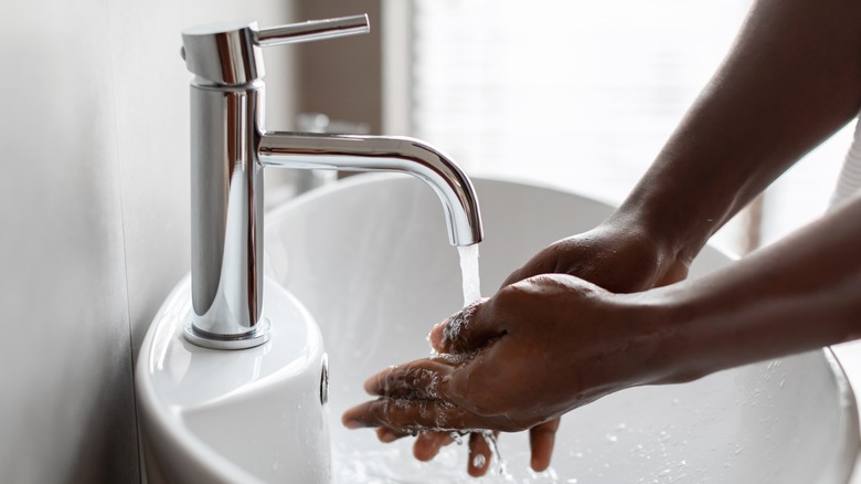 hand-washing in sink