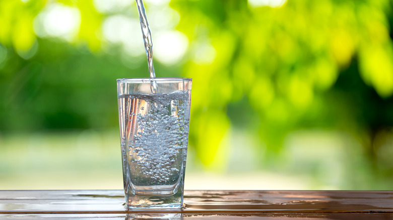 water pouring into glass cup