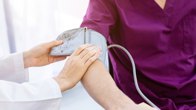 close up of blood pressure cuff on arm