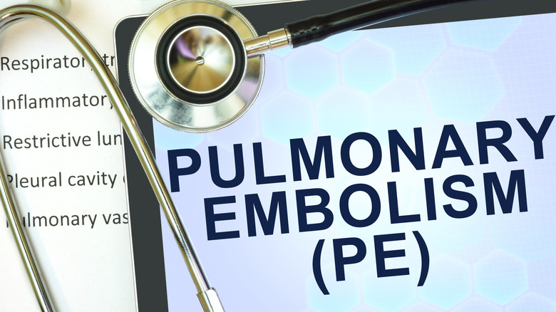 a tablet that says pulmonary embolism with a stethoscope on top of it