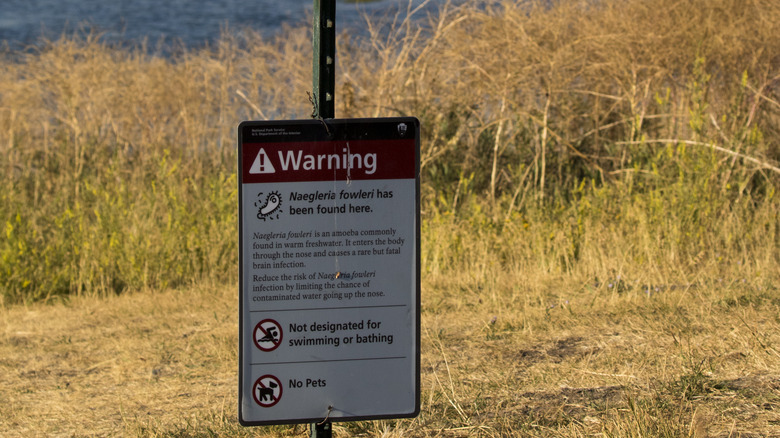 warning sign at pond