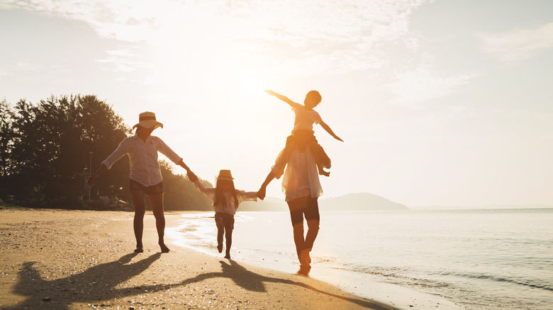 family walking on beach