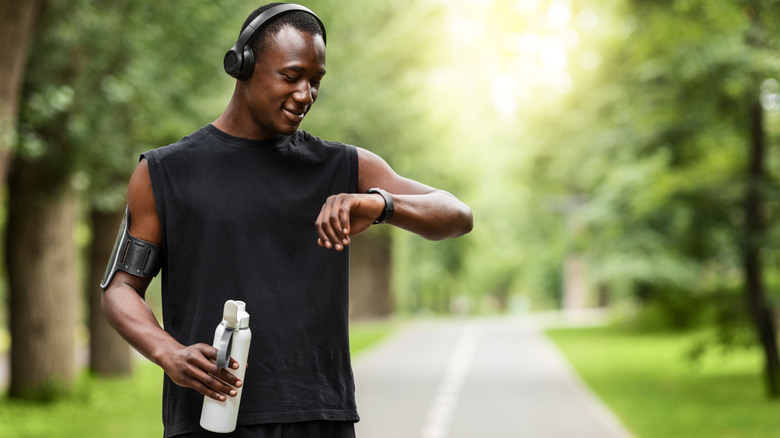 man holding water bottle