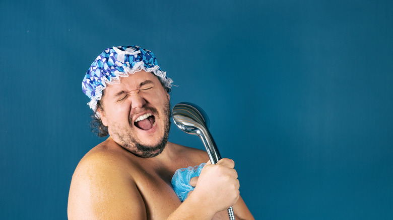 man singing in shower