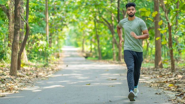 Young man walking outdoors